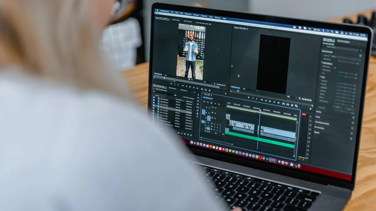 Two editors reviewing a cut together at a workstation