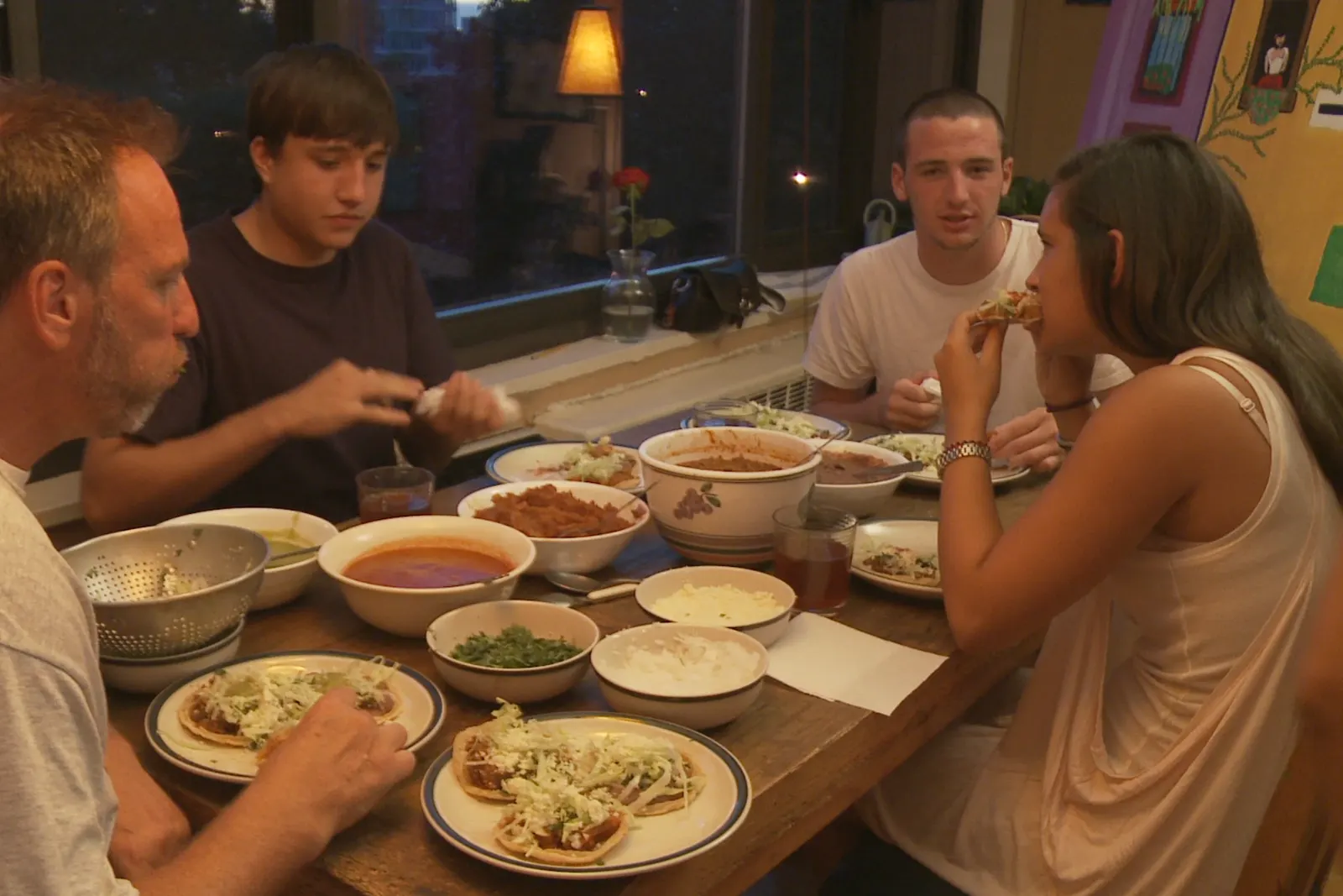 The family gathered for dinner around the table
